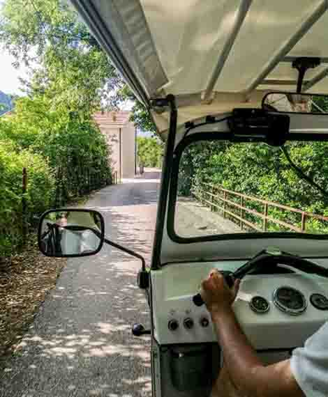 Tuk Tuk vehicle going through Kotor, while on Boka bay tour.